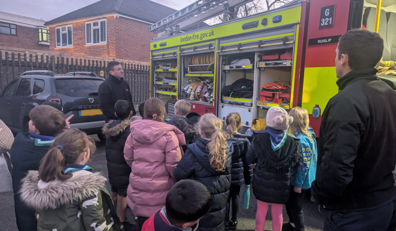 2nd/9th Ruislip Beavers being shown the kit on the fire engine