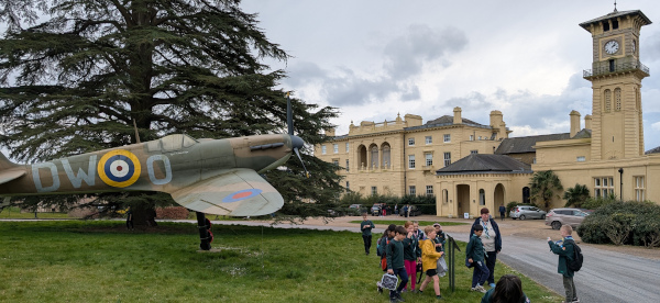 2nd/9th Ruislip Cubs by the Spitfire in front of Bentley Priory Museum